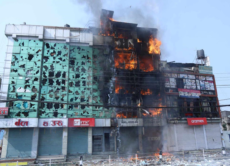 Building set on fire by protestors in Tinkune