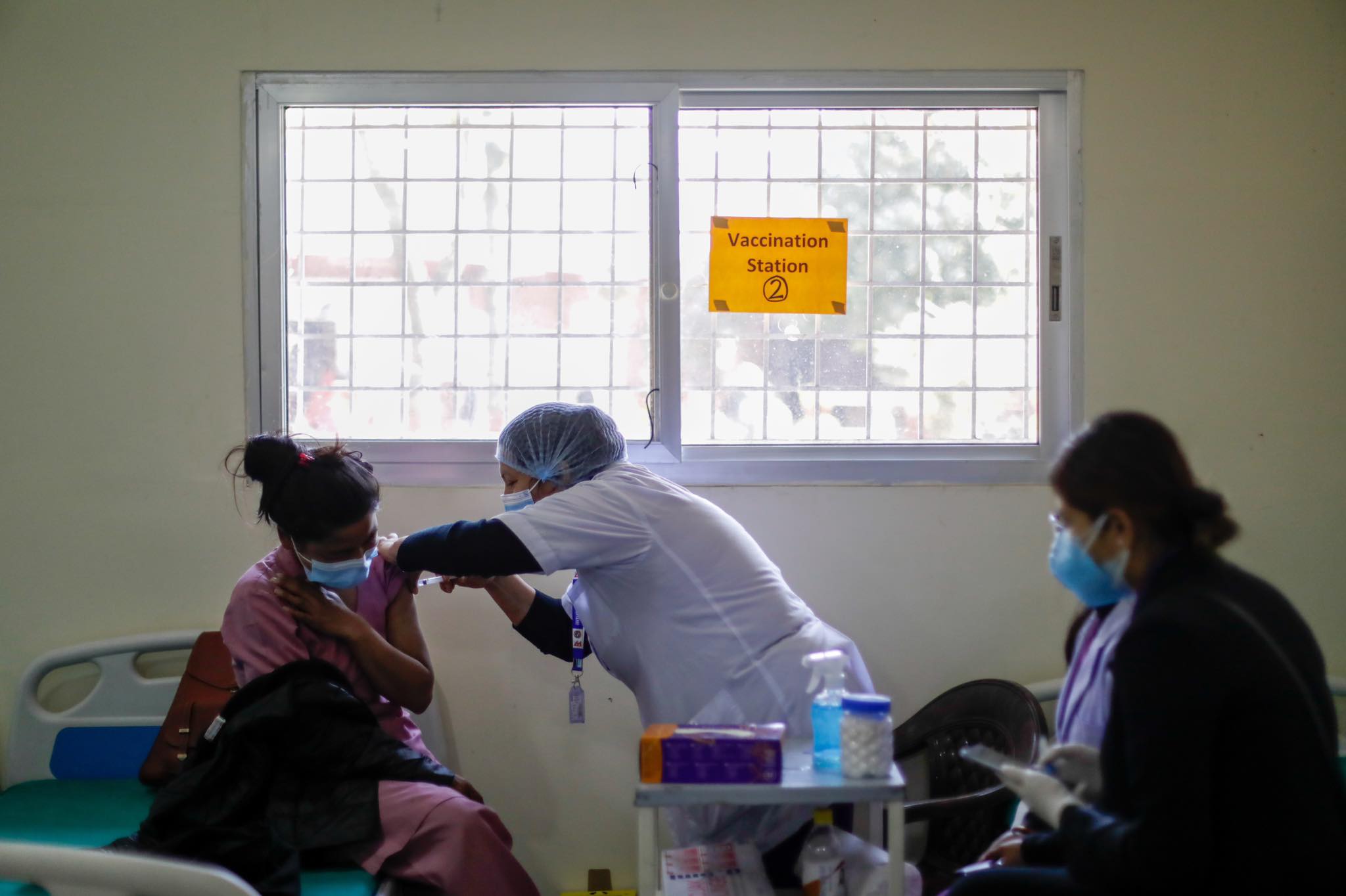 health workers receive covid vaccine