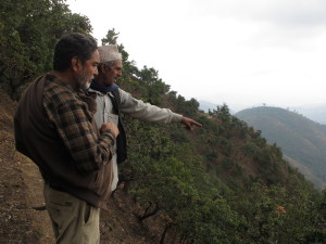 Bhim Neupane (left) talking with a local. 