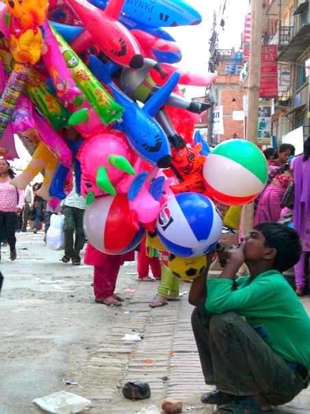 A dozen or so children sell inclated toys like this near Mangal Bajaar in Patan. I think its pretty ironic that they have to sell toys instead of playing with them. 
