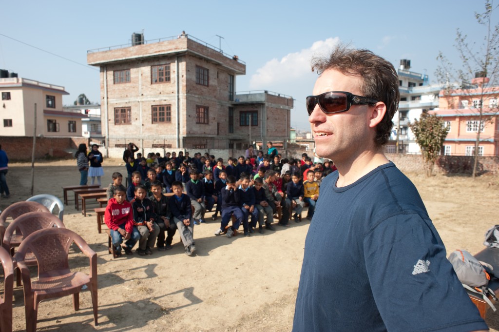 The children were waiting in anticipation, but patiently sat down until the exchange started.