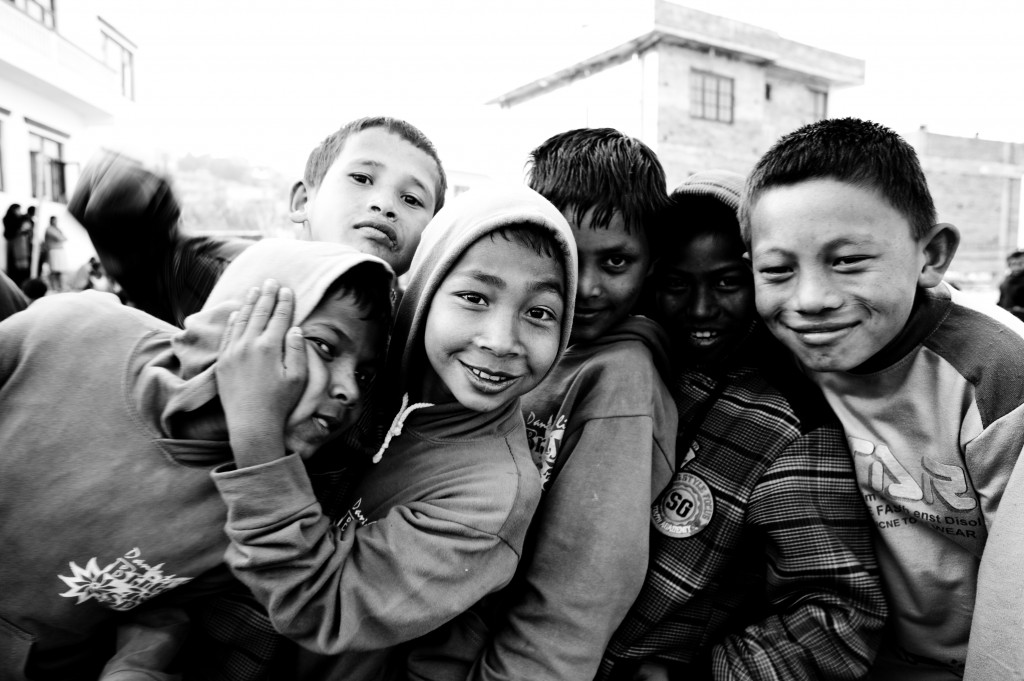 Kids waiting in line for their bicycles never forget to have fun.