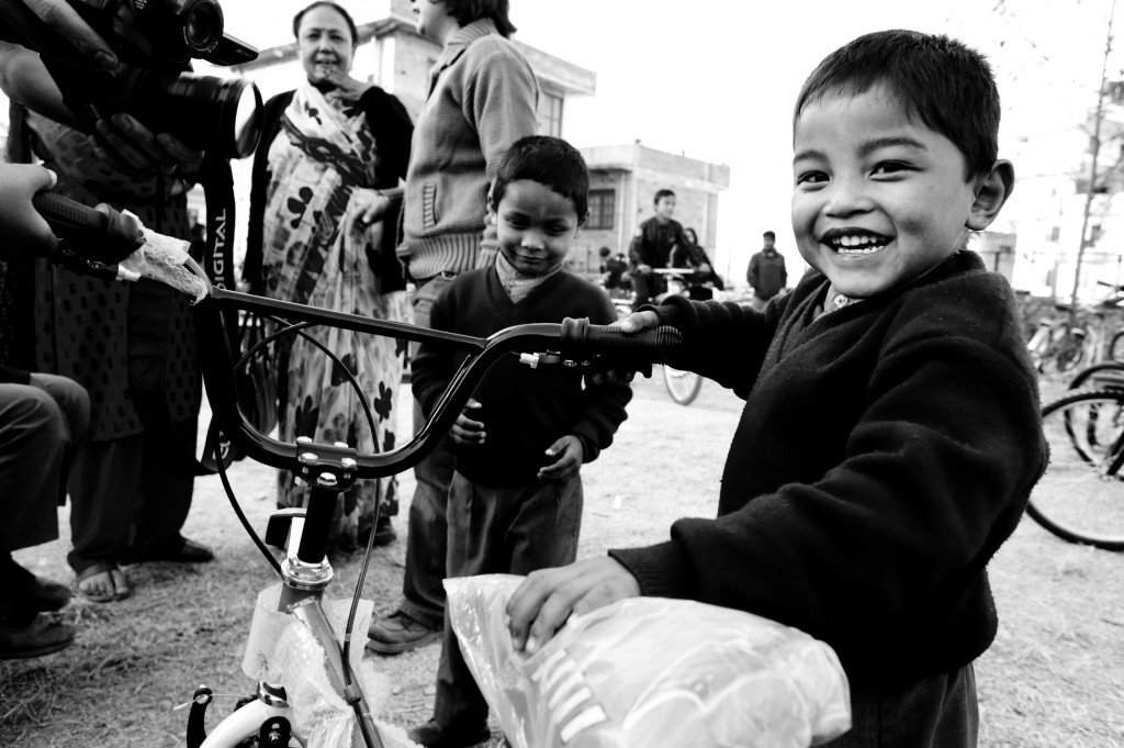 The toddlers were screaming and shedding tears of joy upon sighting the five tricycles given to them.