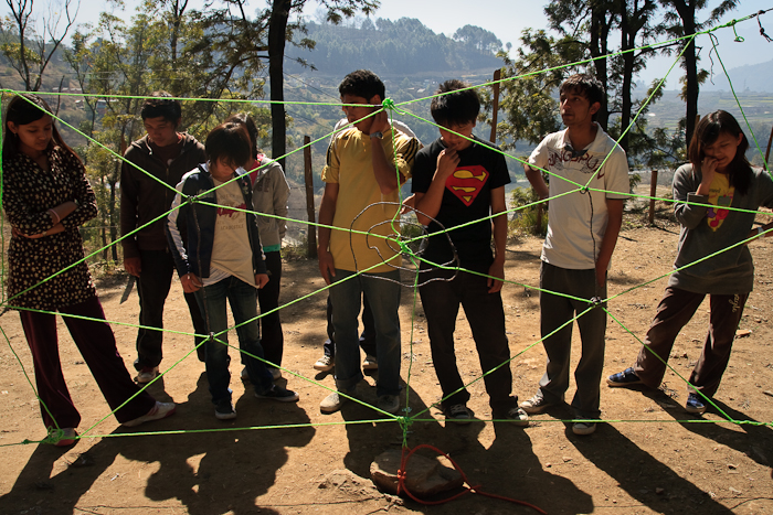 Studying the ‘Spider Web’ before attempting to cross it. The catch is that each outlet may only be used once and the ‘web’ cannot be touched.