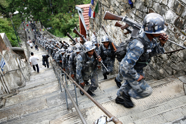 Armed Police Force personnel, whose training base is in Halchowk near Swayambhu, make a round of the stupa as their morning drill everyday. 