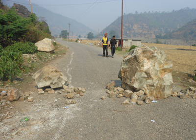 The Saule-Dipayal stretch of the road is littered with logs and boulders.