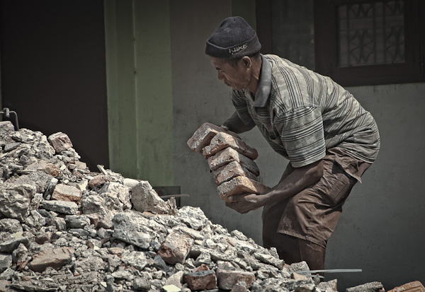 Recycling: a man finds useable bricks to rebuild near Gyaneshwor (7 May)