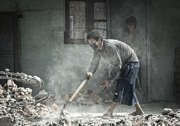 Almost choked: a boy clears the debris after houses in Gyaneshwor were bulldozed (8 May)