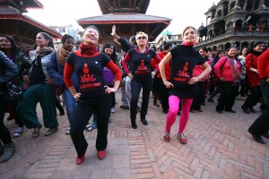 Women wearing the campaign T-shirt lead the rest of the participants in the dance.