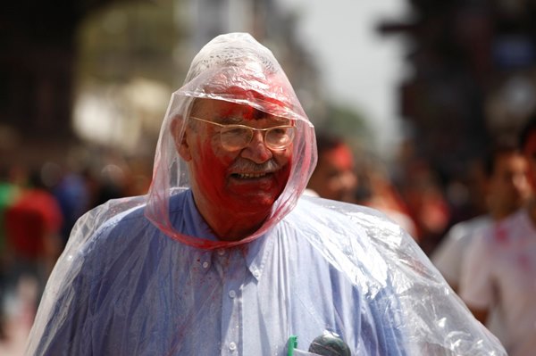 Young and old enjoy the brightly coloured festival as they wash away the winter and celebrate the incoming spring.
