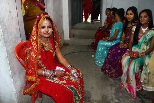 The bride and her friends wait eagerly for the groom's arrival.