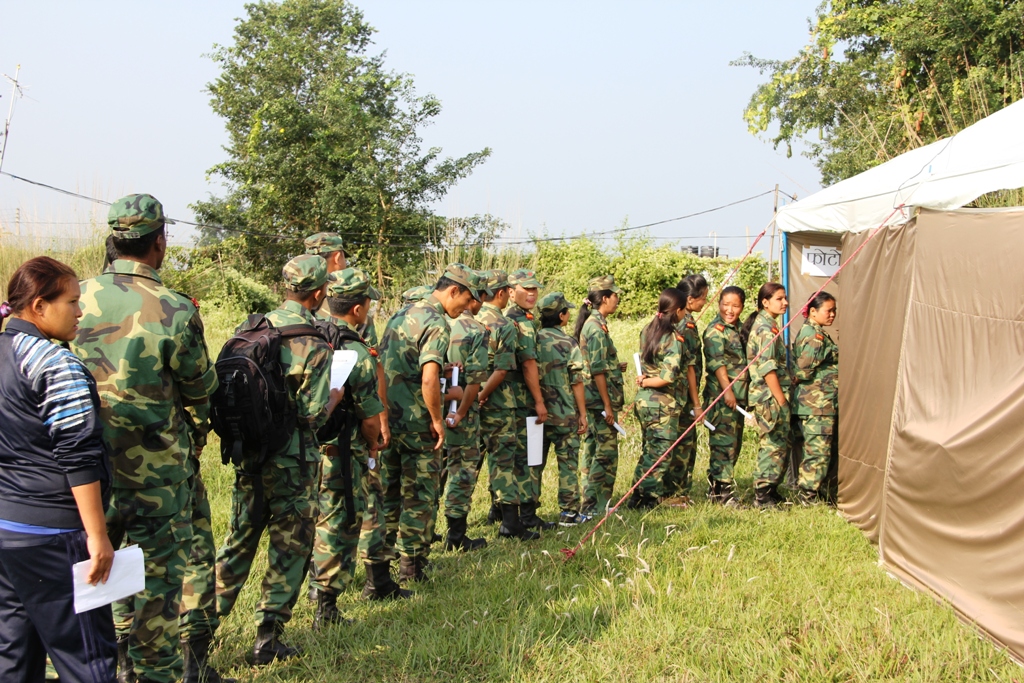 Ex-combatants line up for the regrouping process.