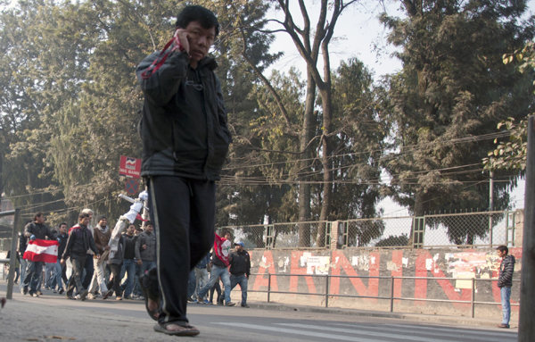 NT_07 Magsaysay Award winner Mahabir Pun passes by protesters at Ratnapark