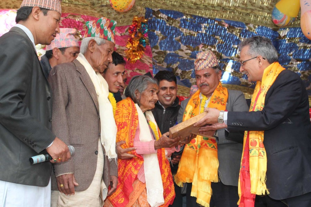Bal Krishna Dhungel (center) with Baburam Bhattarai at a program in Okhaldhunga two weeks ago. Photo:Nagarik