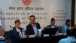 Nepali Congress leaders Sushil Koirala and Sher Bahadur Deuba with FNCCI's Suraj Vaidya (centre) at a discussion regarding business and election manifestos on Sunday.