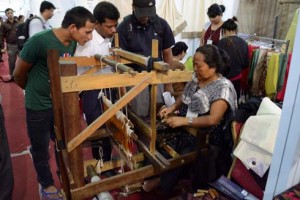 Dev Maya Limbu from Terathum has been actively involved in making caps, mufflers, saaris and cholo using the loom. She demonstrates the making process to the audiences at Nepali times eco fair on Thursday.