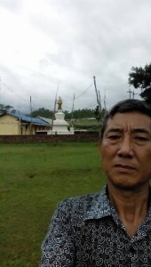 Dorji Tsering Sherpa at Bastipur's school and stupa.
