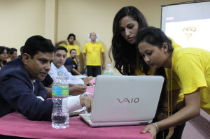 Sunita Thapaliya (left) and Shilu Pradhan discussing their project with Resta Jha, one of the judges.