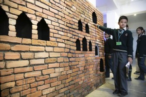 A student discovering the history of a stolen sculpture with Davis' Revisiting Kathmandu © Nischal Oli