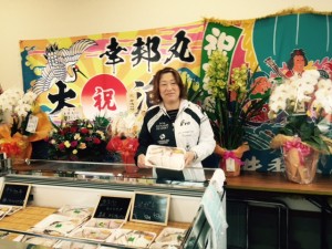 A survivor of Tohoku earthquake and tsunami at her newly opened fish shop.