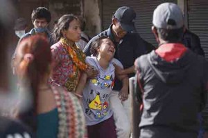 Maya Lama cries in shock after her brother's body is recovered from a collapsed guest house in Gongabu on Friday. Photo: Bikram Rai