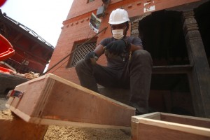 Buddhacharya looking for tiny artefacts in the dust. Pic: Gopen Rai