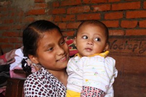 Sonia Awal was also rescued alive and now baby sits her baby brother when she is home from school.
