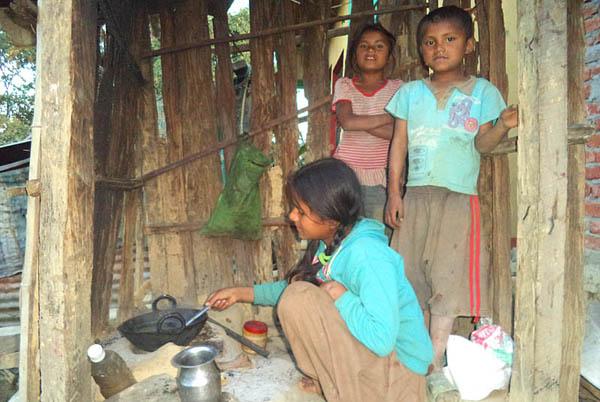 11-year old Manju preparing a meal for her siblings. Pic: Laxmi Bhandari
