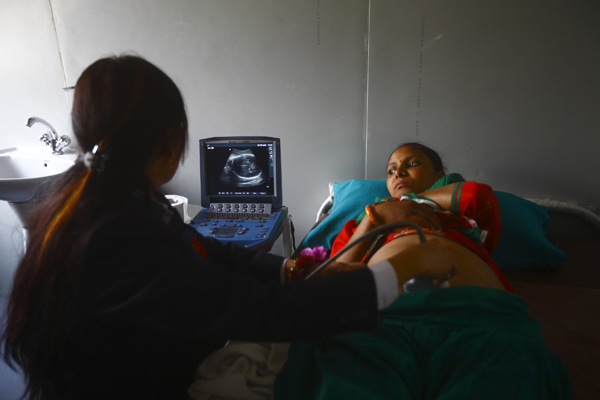 An ultrasound being performed by a trained health professional in the recently inaugurated Indrawati Jana Sewa Samiti Health Post in Sindhupalchowk.